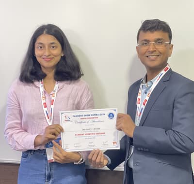 Dr. Roopa receiving a professional certification