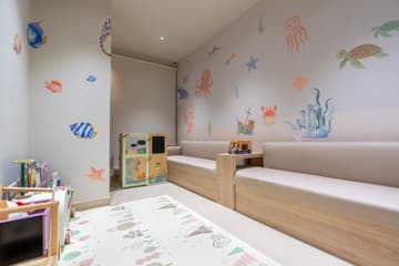 Kids' corner with ocean-themed mural